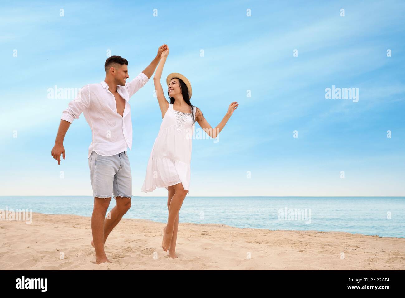 Dancing on beach hi-res stock photography and images - Alamy