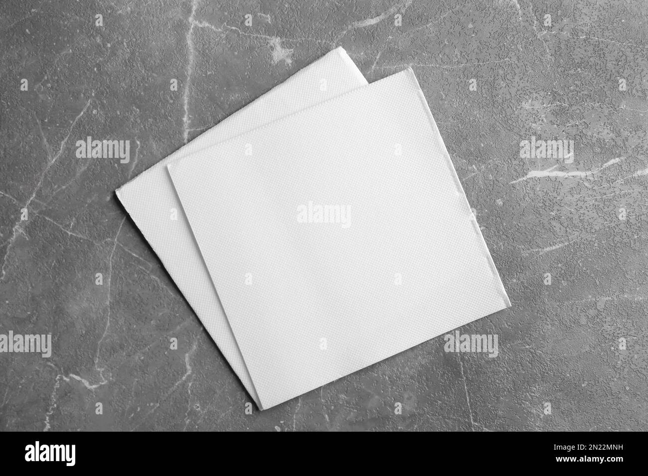 Clean napkins on marble table, top view Stock Photo