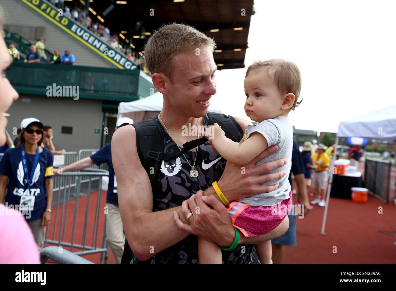 Galen Rupp is shown holding his daughter, Emmie, at the U.S. track and ...