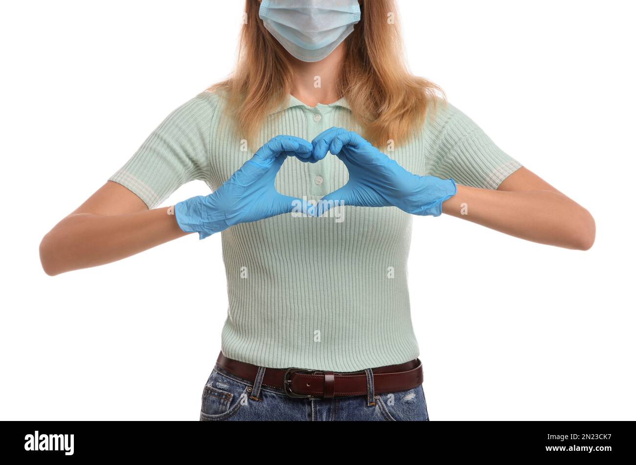 Woman in medical gloves and protective mask making heart with hands on ...