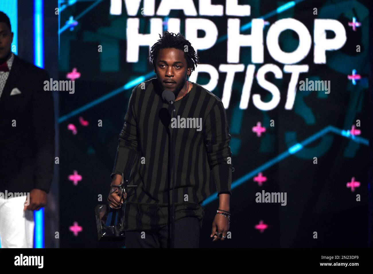 Kendrick Lamar accepts the award for best male hip hop artist at the