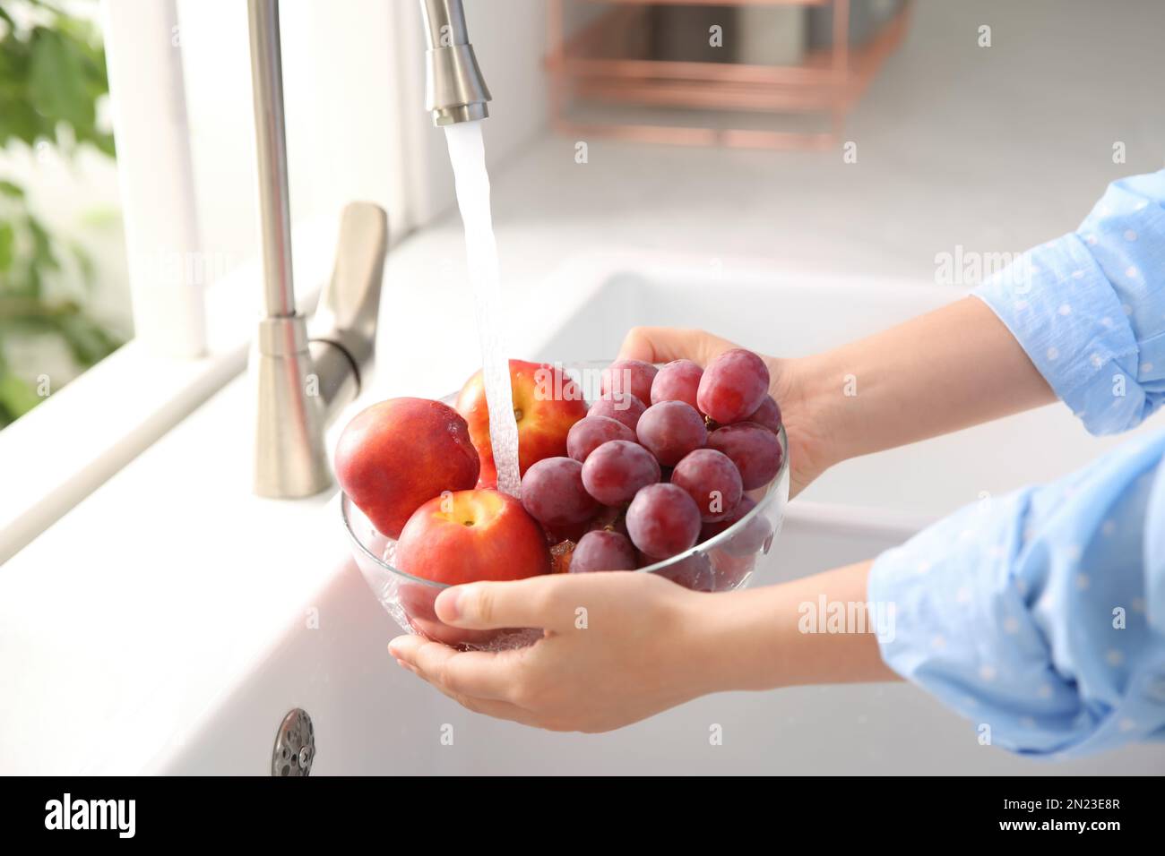 Closeup hands washing fresh fruits hi-res stock photography and images ...
