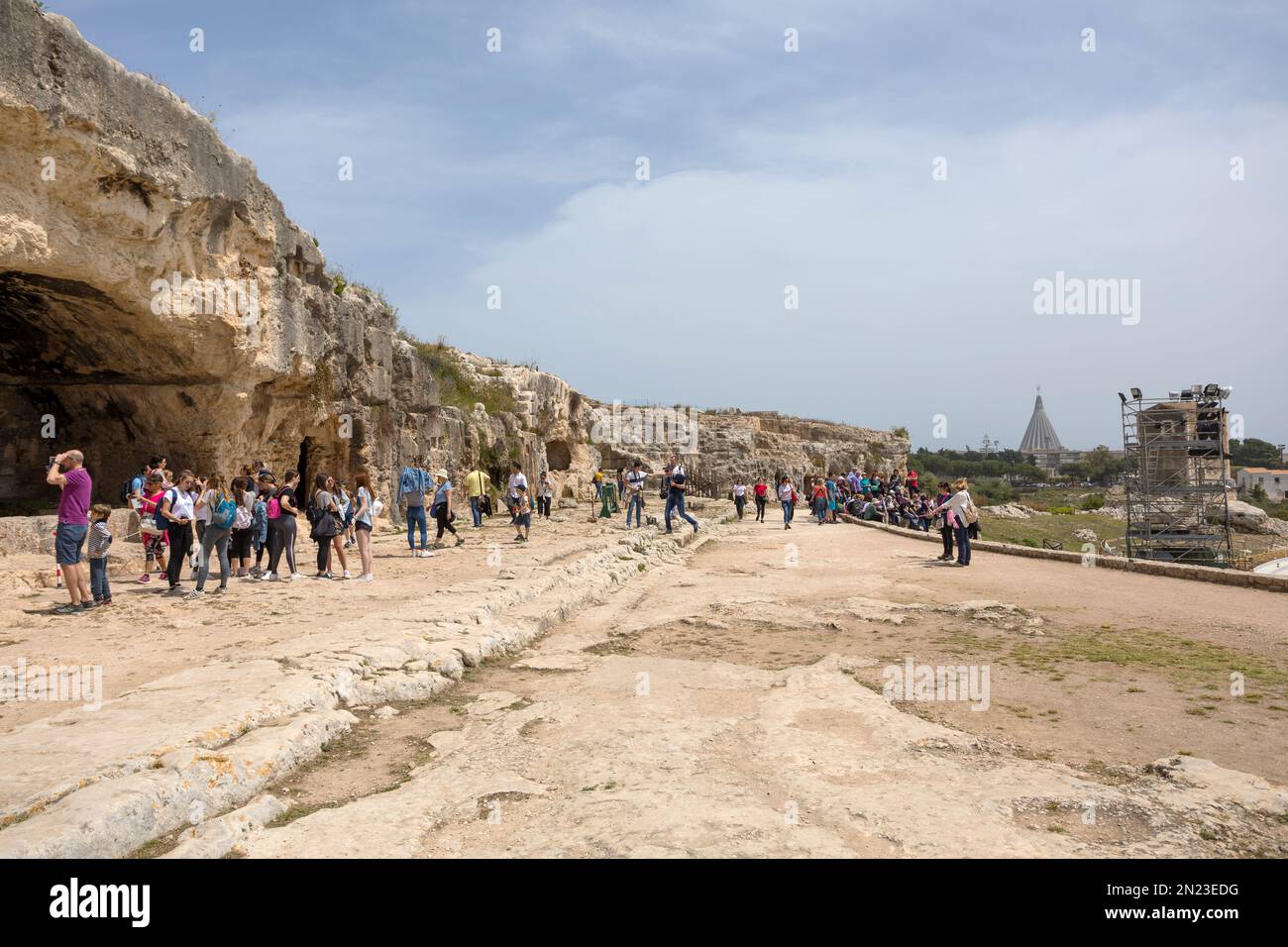 SYRACUSE, SICILY  - APRIL 23, 2019: Tourists visit the Parco Archeologico Neapolis in Syracuse, Sicily Stock Photo
