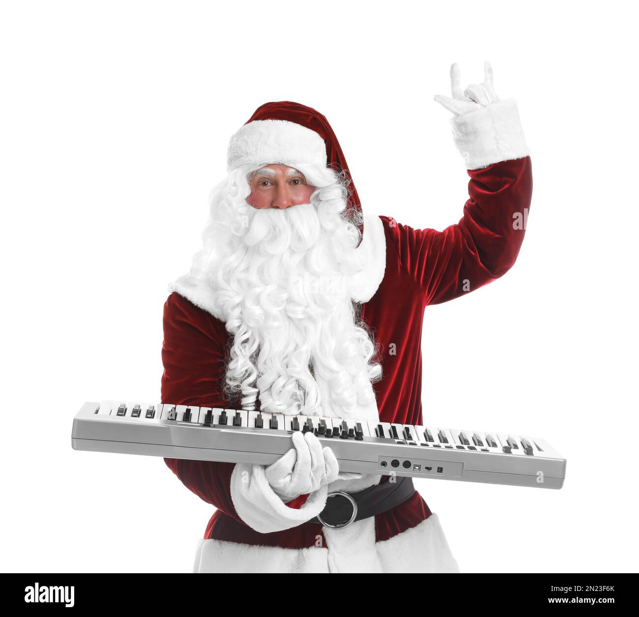 Santa Claus with synthesizer on white background. Christmas music Stock