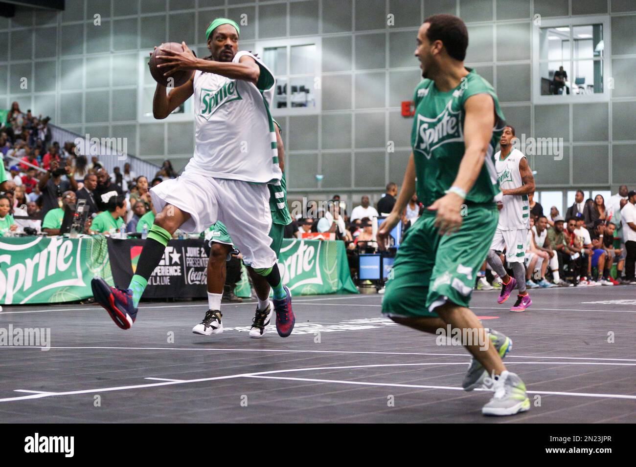 Snoop Dogg, left, and French Montana play in the Sprite Celebrity Basketball  Game during the 2015 BET Experience at the Los Angeles Convention Center on  Saturday, June 27, 2015, in Los Angeles. (