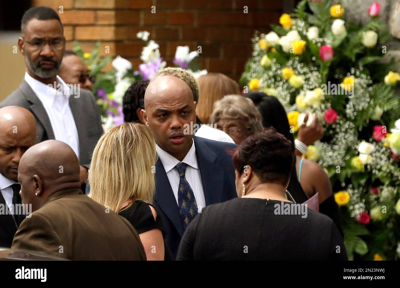 Former NBA star Charles Barkley and family arrive for the funeral of