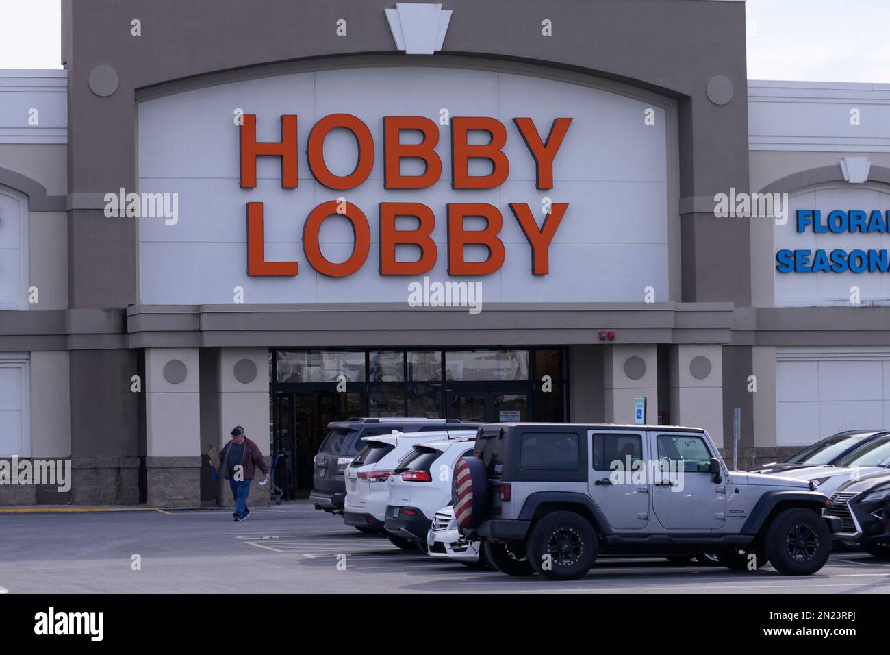 A shopper leaves the Hobby Lobby store, Monday, Feb. 6, 2023, in