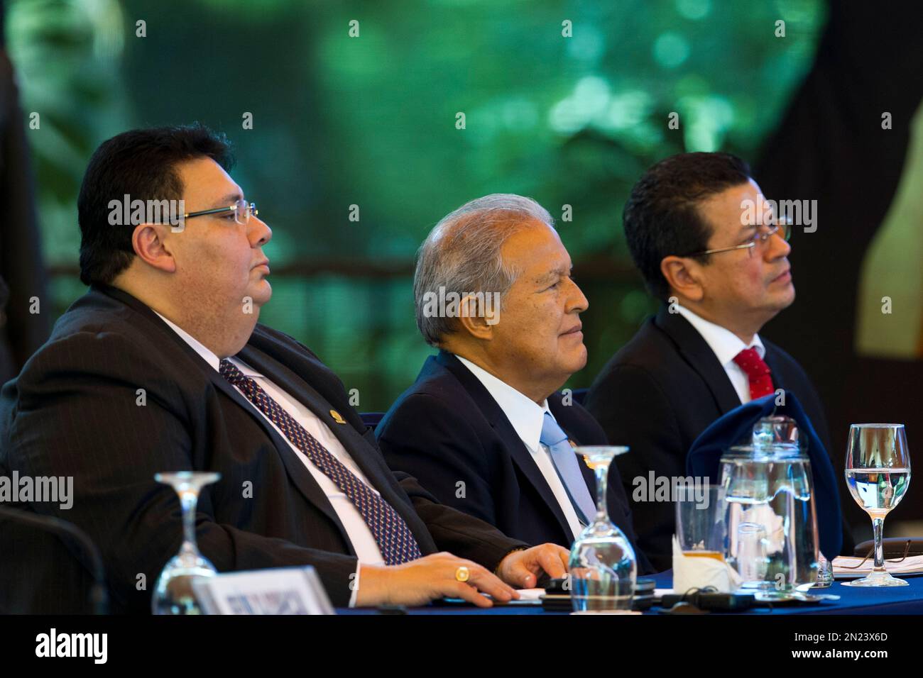 El Salvador's President Salvador Sanchez Ceren, center, accompanied by his  Foreign Minister Hugo Martinez, right, and Economy Minister Tharsis Solomon  Lopez attend the XLV Central America Integration System, SICA, summit in  Antigua,