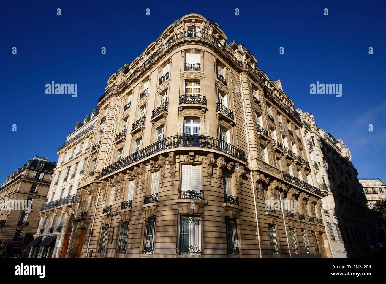 The facade of traditional French house with typical balconies and