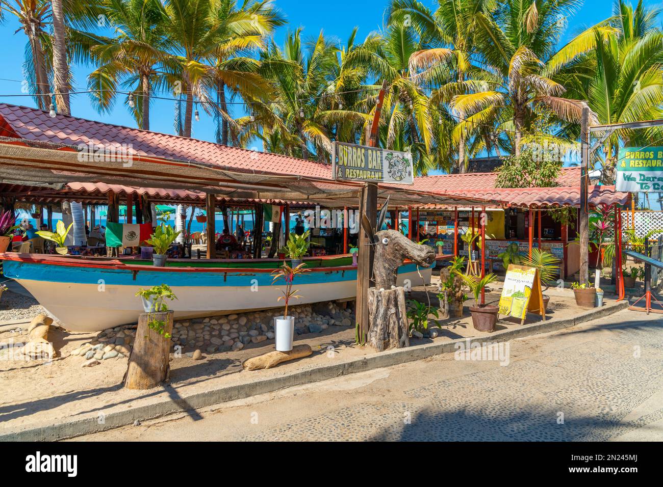The Burros Bar and Restaurant on the touristic Olas Altas street along Los Muertos beach in the Zona Romantica district of Puerto Vallarta, Mexico. Stock Photo