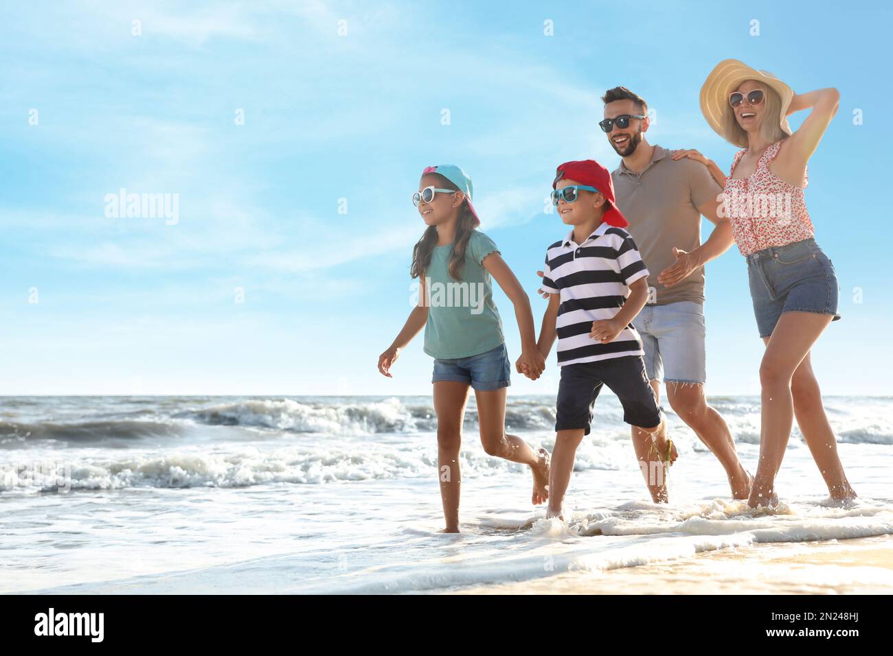 Happy family running hi-res stock photography and images - Alamy
