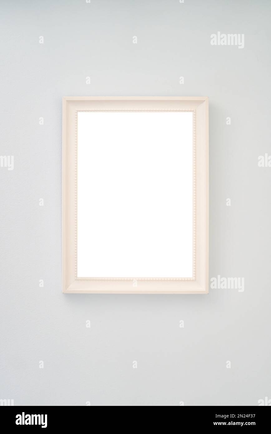 Beige empty photo frame hanging on the wall Stock Photo - Alamy