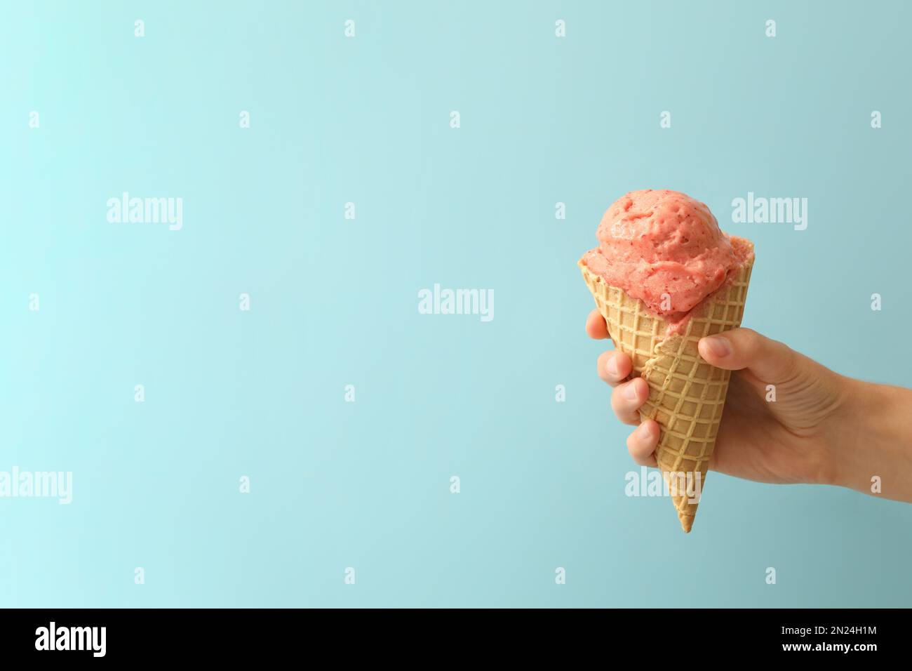 Pastel pink ice cream scoops in rows on blue background - Free