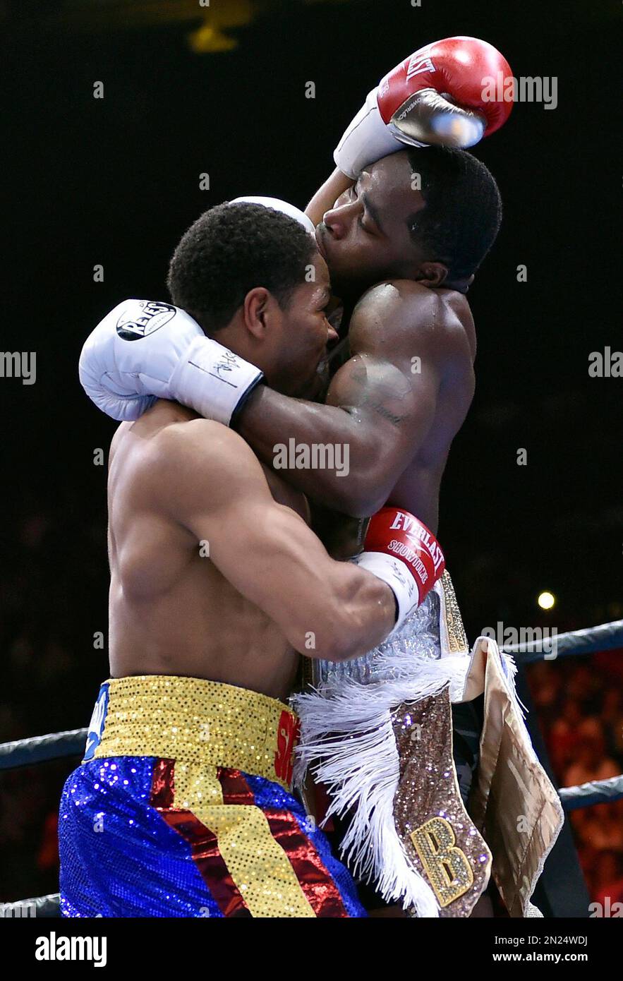 Shawn Porter, left, and Adrien Broner battle during their welterweight