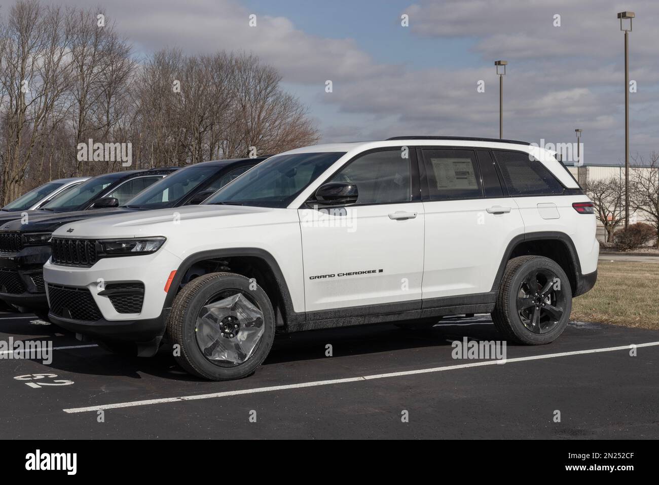 Kokomo - Circa February 2023: Jeep Grand Cherokee display at a dealership. Jeep offers the Grand Cherokee in Laredo, Limited, and Trailhawk models. Stock Photo