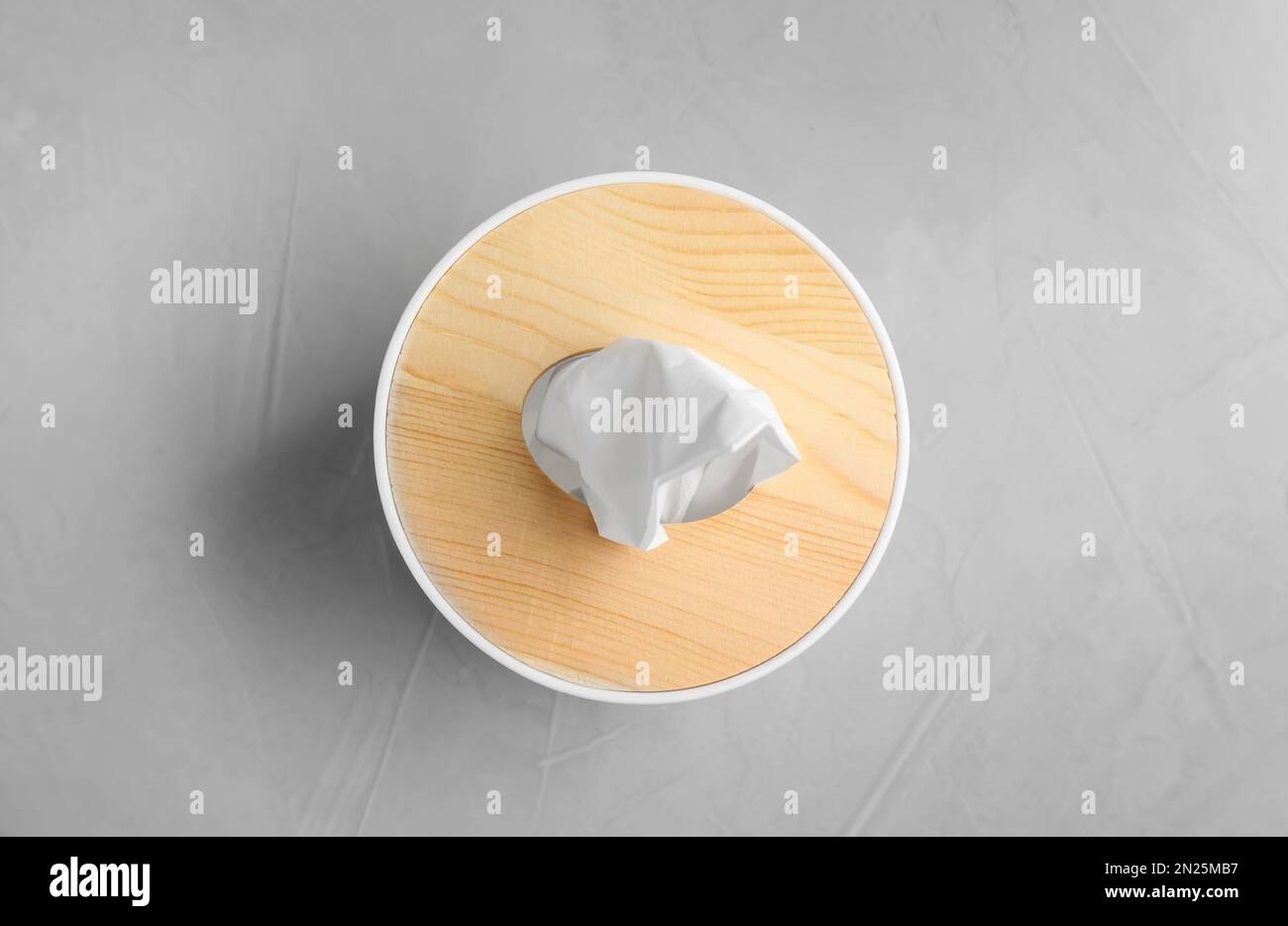 Wooden box of tissues on light table, top view Stock Photo