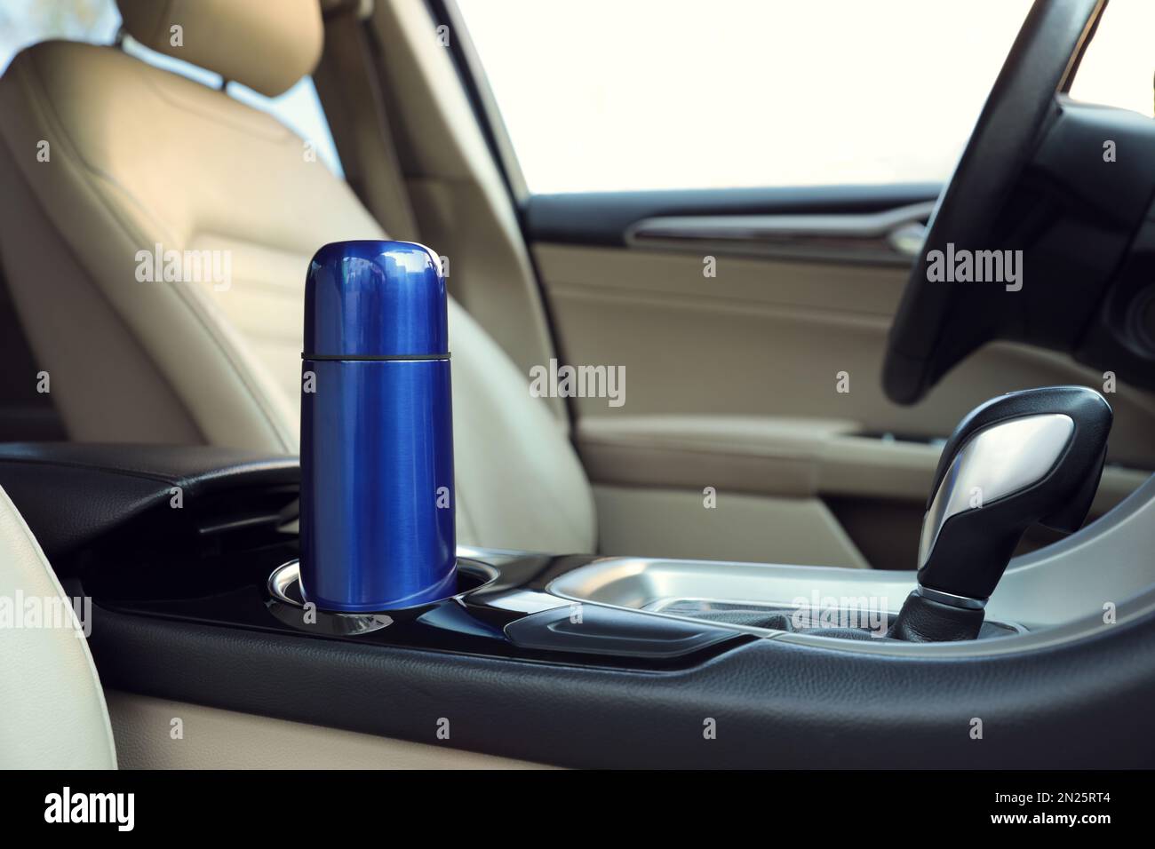 Blue thermos in holder inside of car Stock Photo Alamy