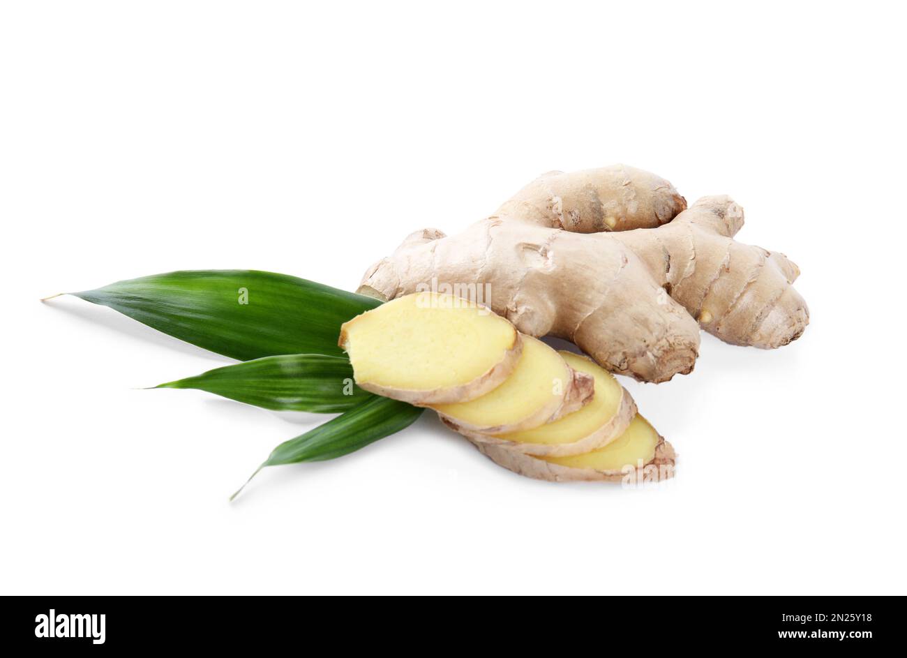 Whole and cut fresh ginger with leaves isolated on white Stock Photo
