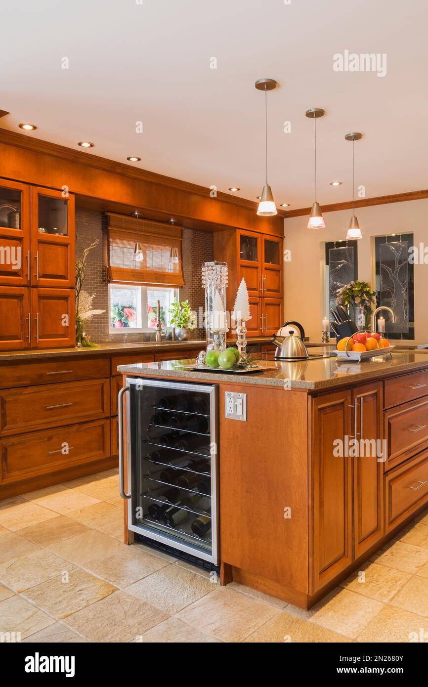 https://c8.alamy.com/comp/2N2680Y/cherry-wood-cabinets-and-island-with-quartz-countertops-in-kitchen-inside-old-renovated-circa-1840-canadiana-cottage-style-home-2N2680Y.jpg
