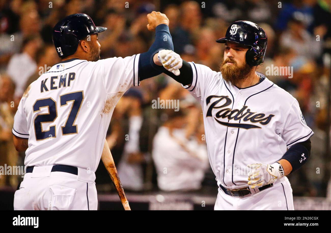 San Diego Padres' Derek Norris, right pounds forearms with Matt Kemp after his two run homer