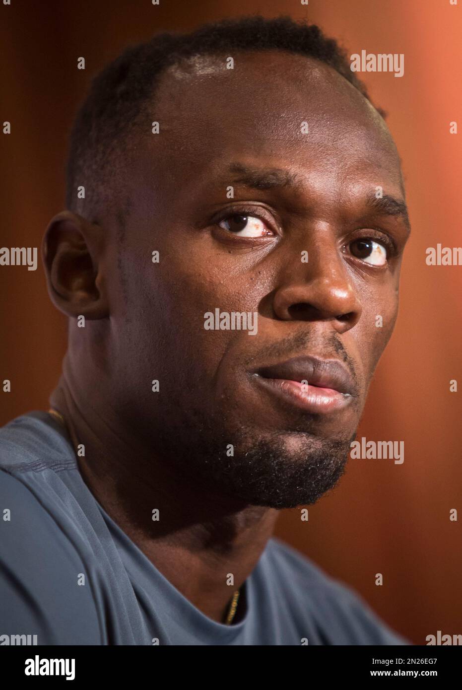 Jamaican sprinter Usain Bolt, an Olympic gold medalist and world record holder, listens during a