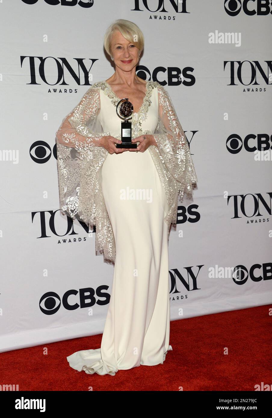Helen Mirren poses in the press room with the award for best ...