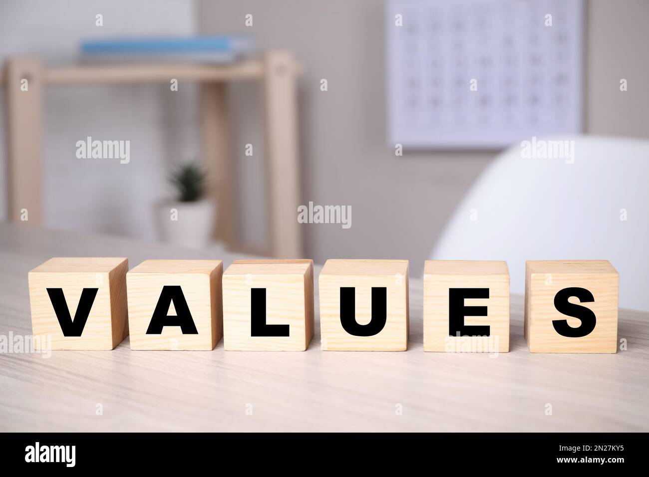 Cubes with word VALUES on wooden table Stock Photo
