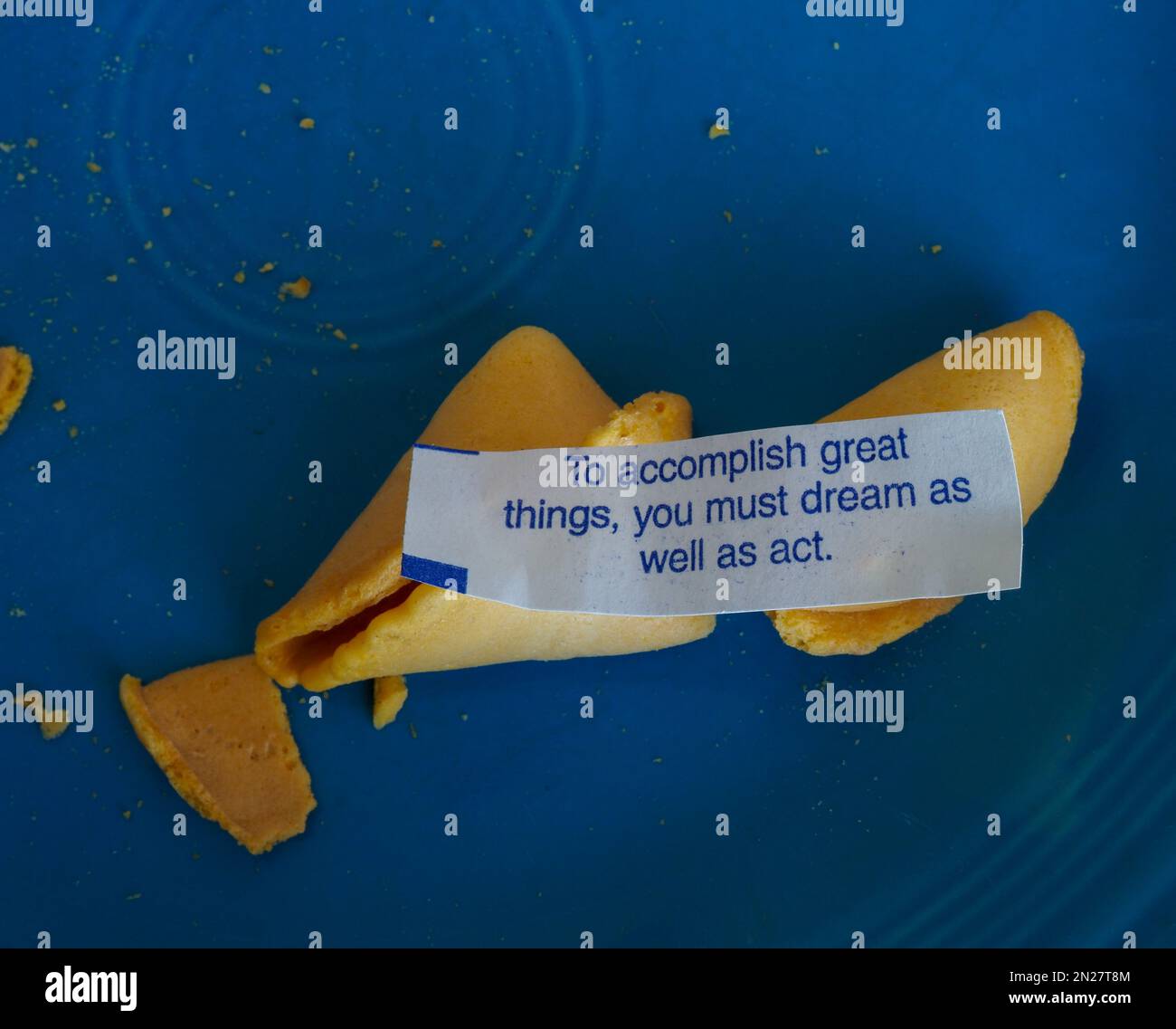 Fortune cookie positing that dreams happen when you act. Stock Photo