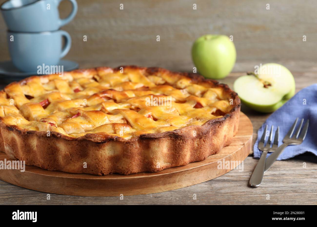 Fresh traditional apple pie on wooden table, closeup Stock Photo