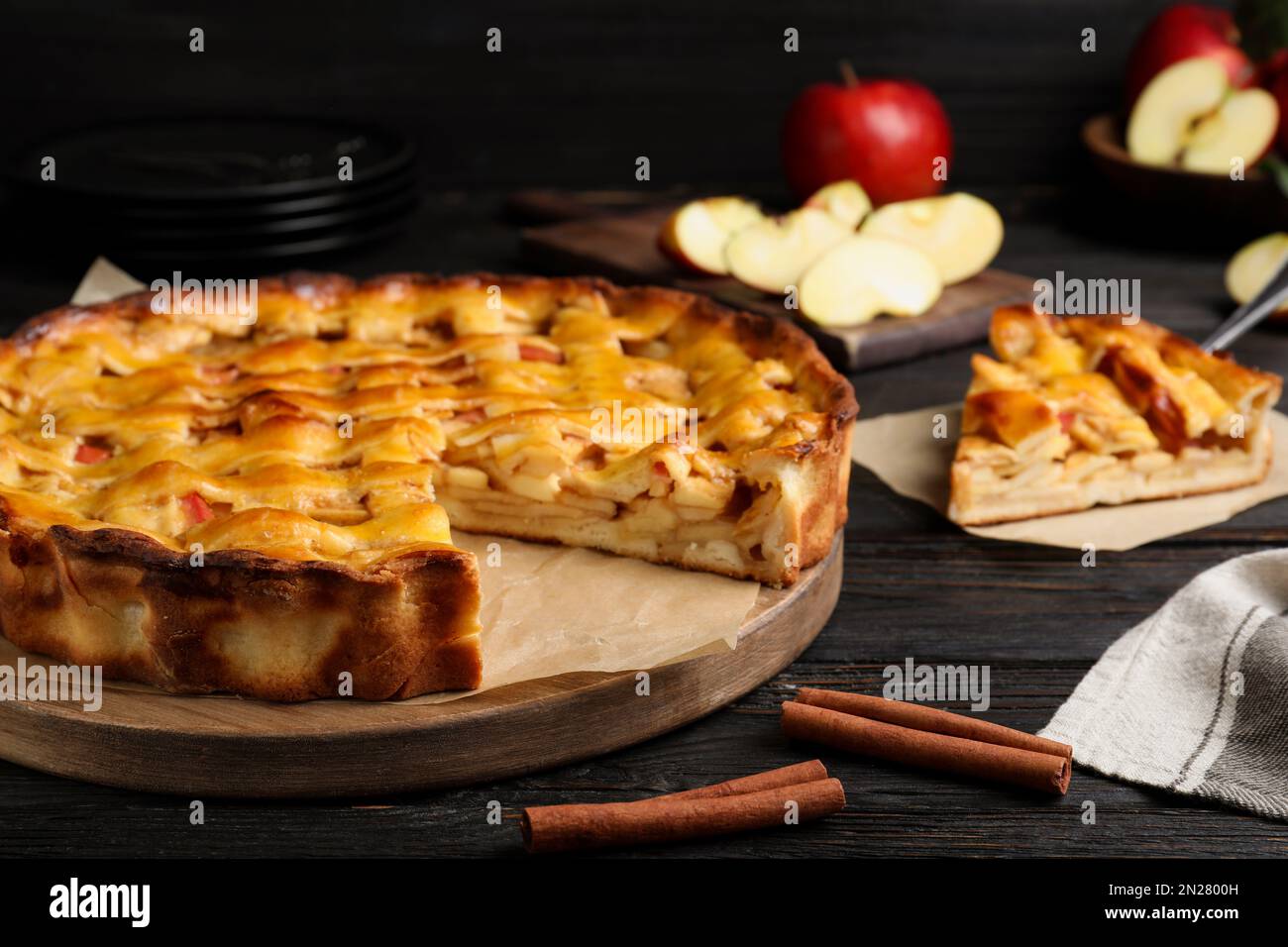 Traditional apple pie on black wooden table Stock Photo