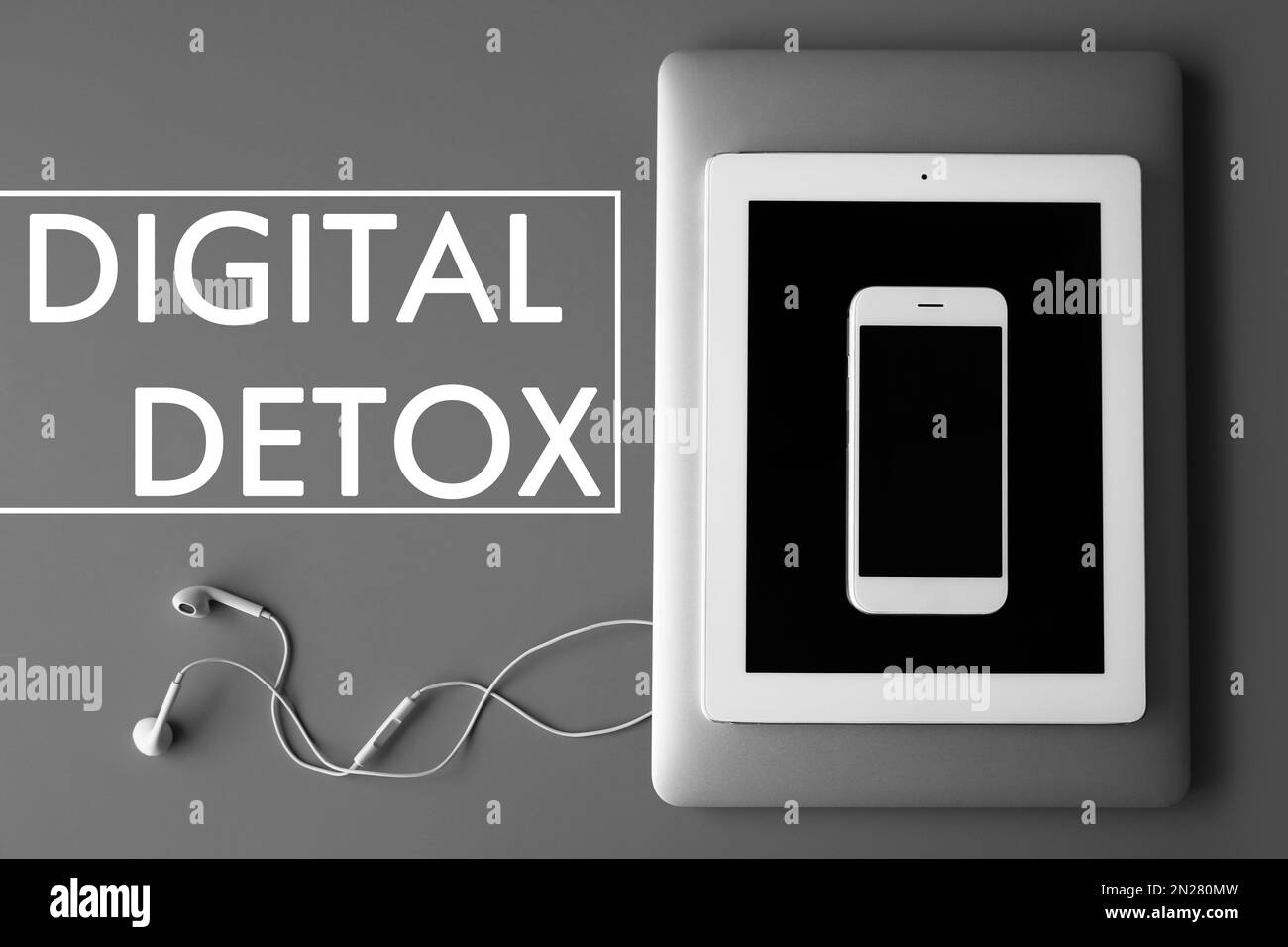 Text Digital detox and devices on grey background, top view Stock Photo