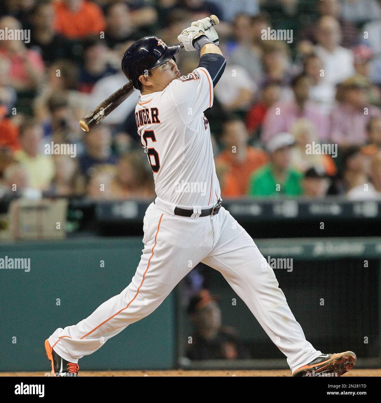 Houston Astros' Hank Conger hits a home run in the third inning of a baseball game against the