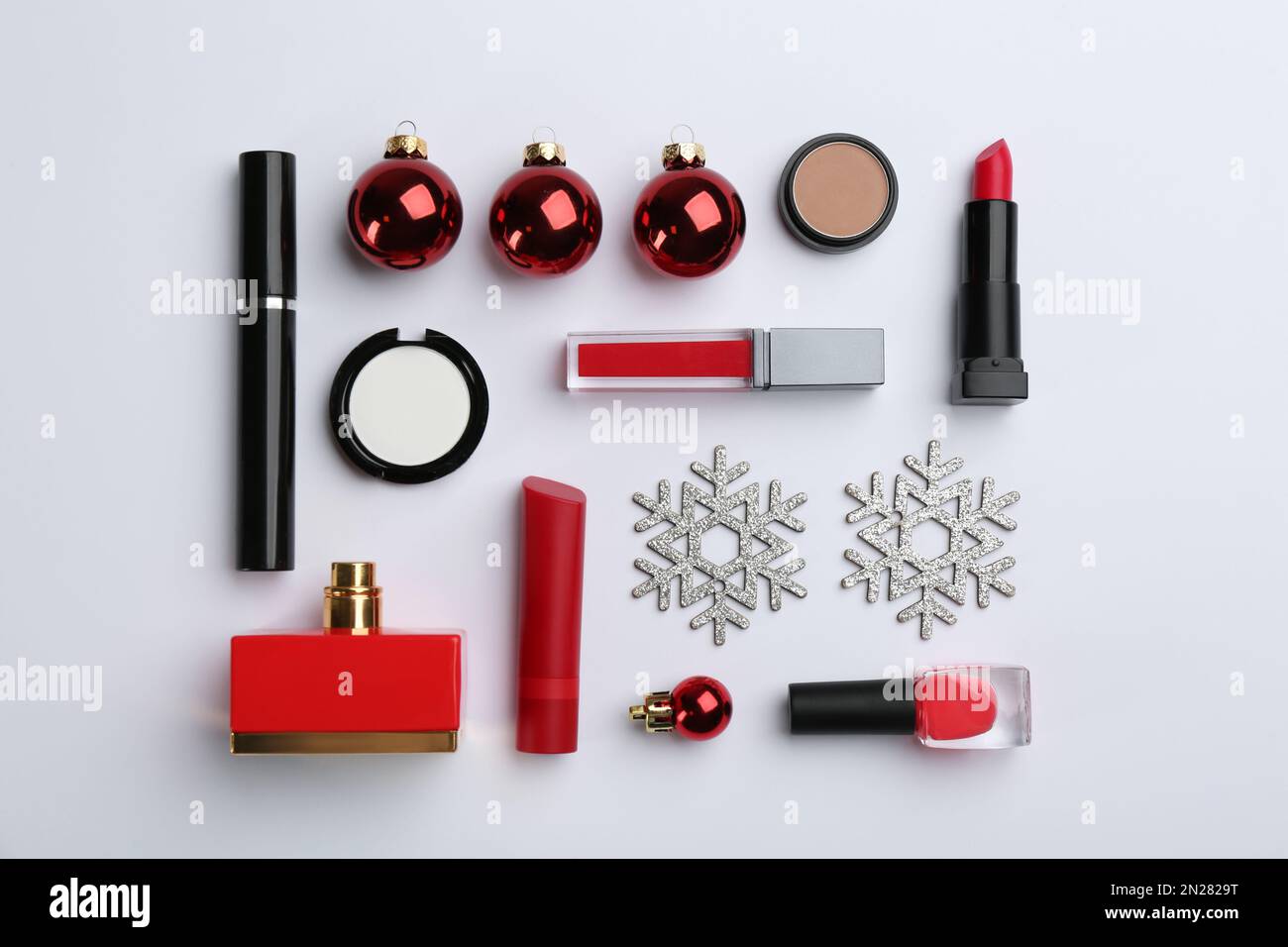 Flat lay composition with decorative cosmetic products on light ...
