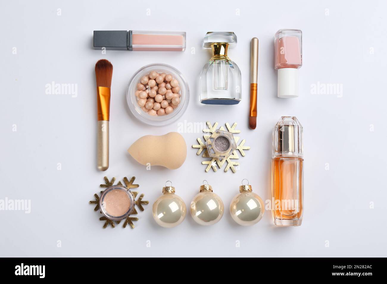 Flat lay composition with decorative cosmetic products on light ...