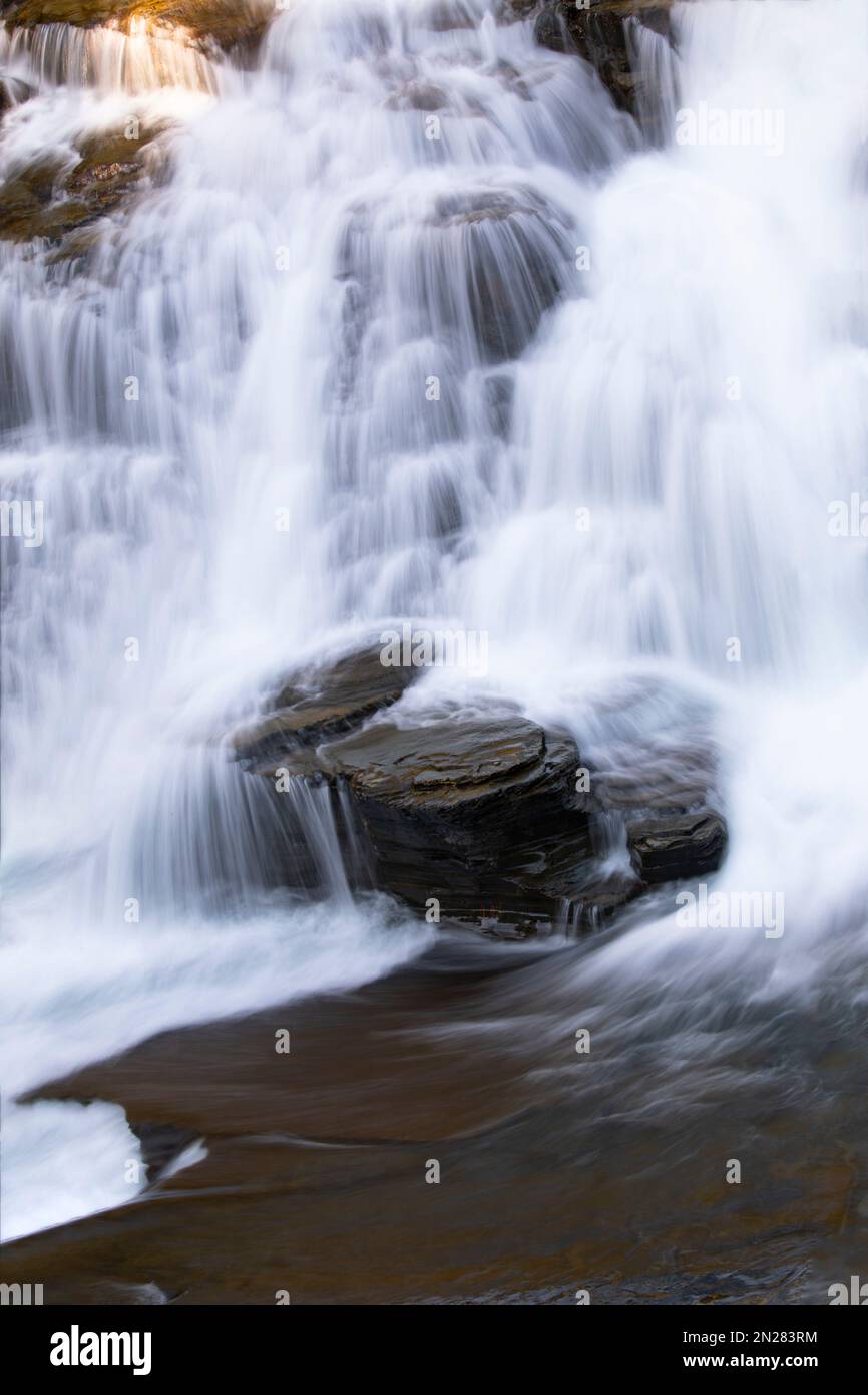 Beautiful cascading waterfall, rock steps, and pure pool of falls along ...