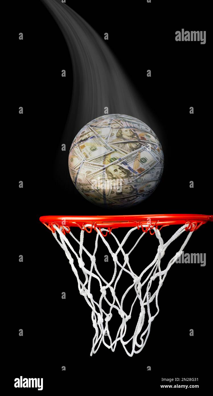 Money Ball going into the basketball hoop Stock Photo Alamy