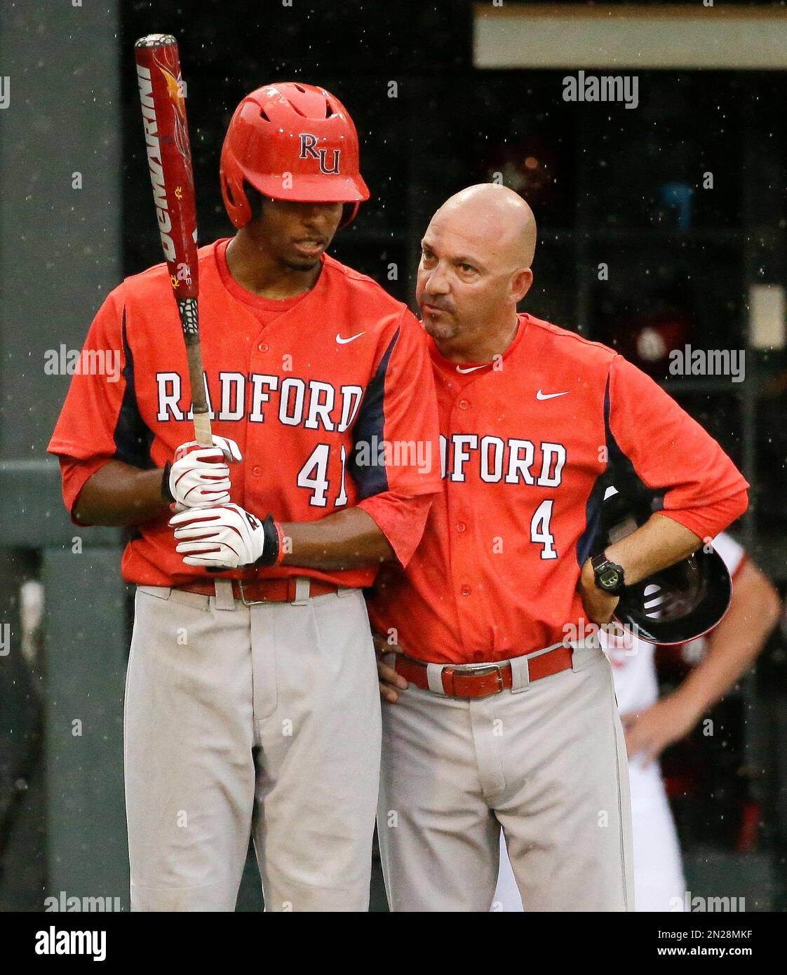 Joe Raccuia Radford head coach Joe Raccuia (4) talks with Brad Keen (41) in the ...