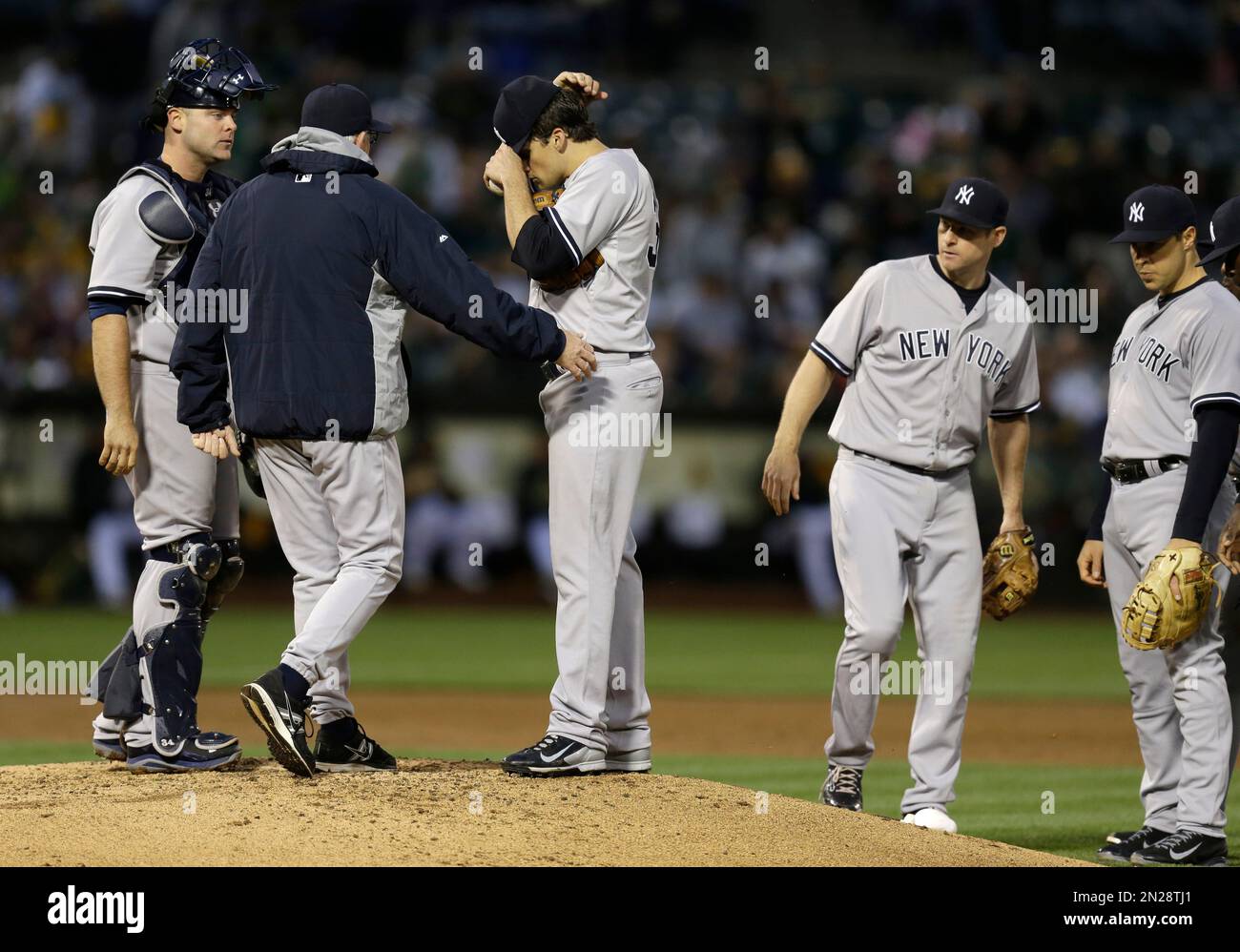 New York Yankees pitching coach Larry Rothschild, second from left ...