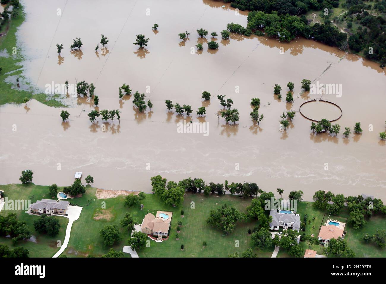 Flood waters from the Brazos River encroach upon homes in the Horseshoe