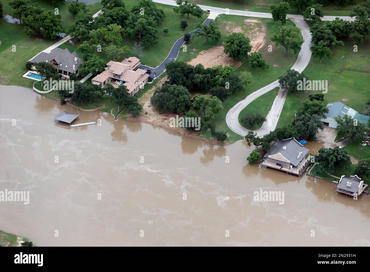 Flood waters from the Brazos River encroach upon homes in the Horseshoe