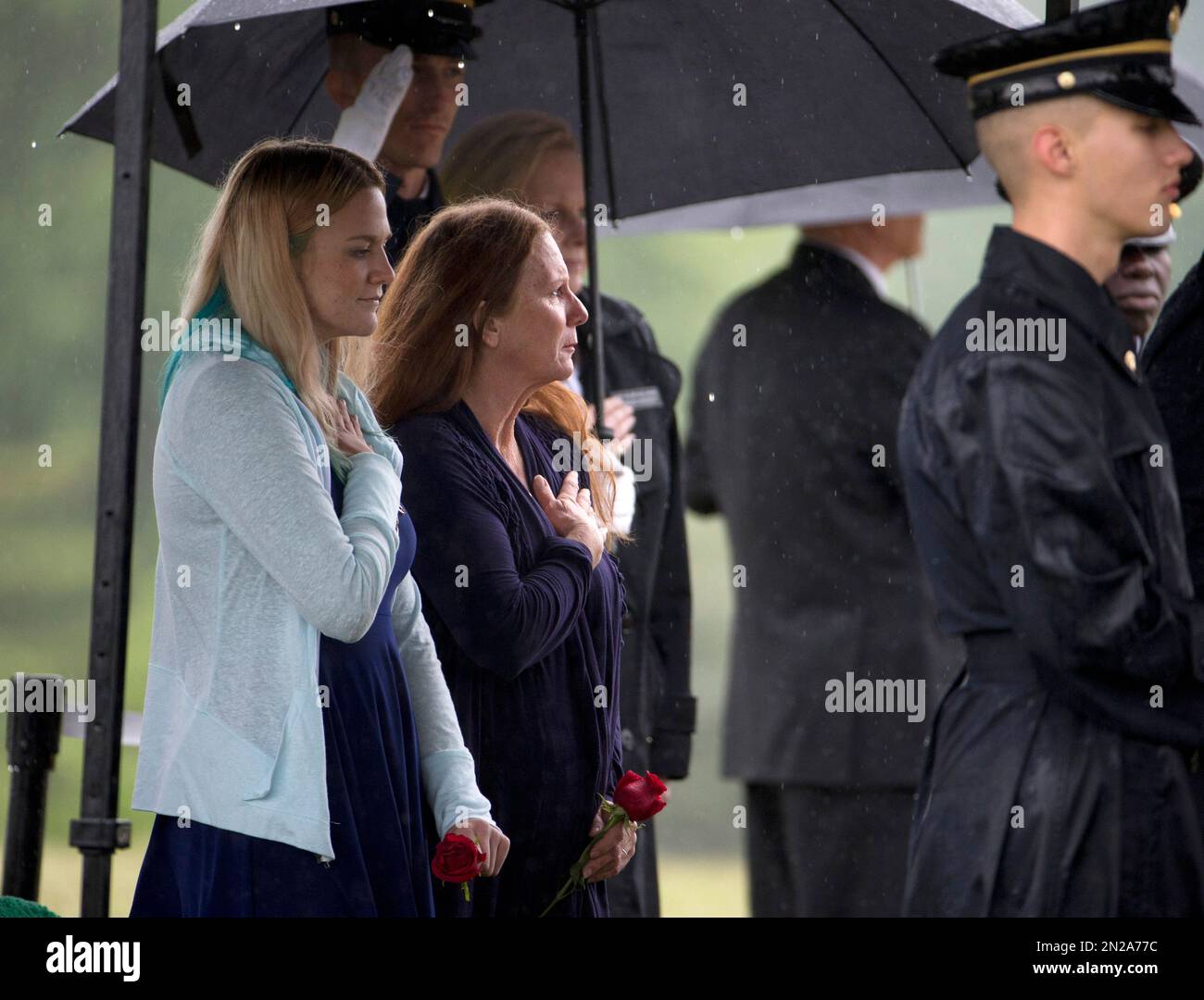 Julie Houx, second from left, the niece of a missing soldier from