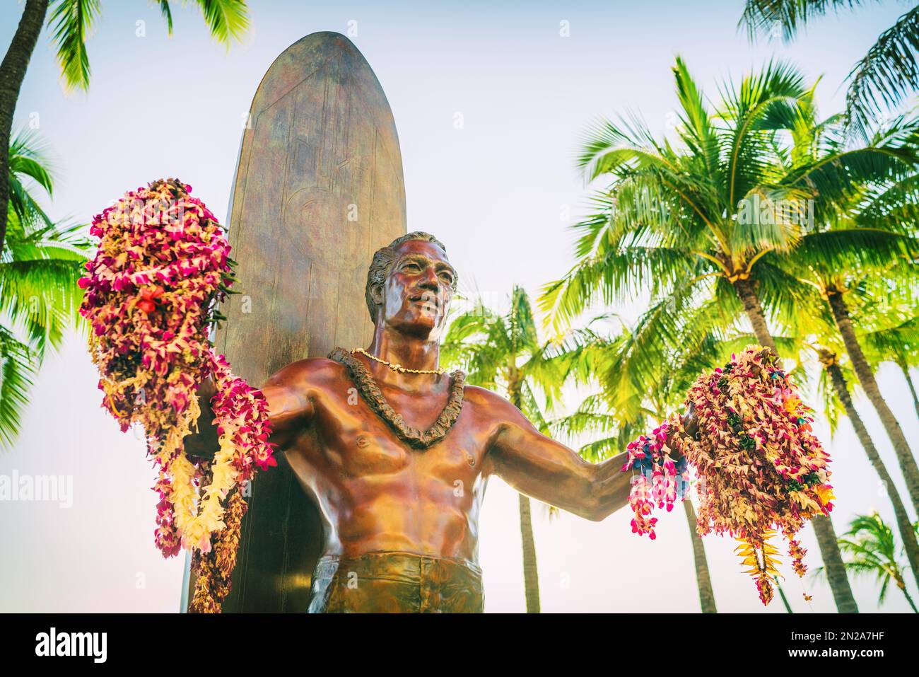 Hawaii travel destination. Duke Kahanamoku statue with leis in Waikiki