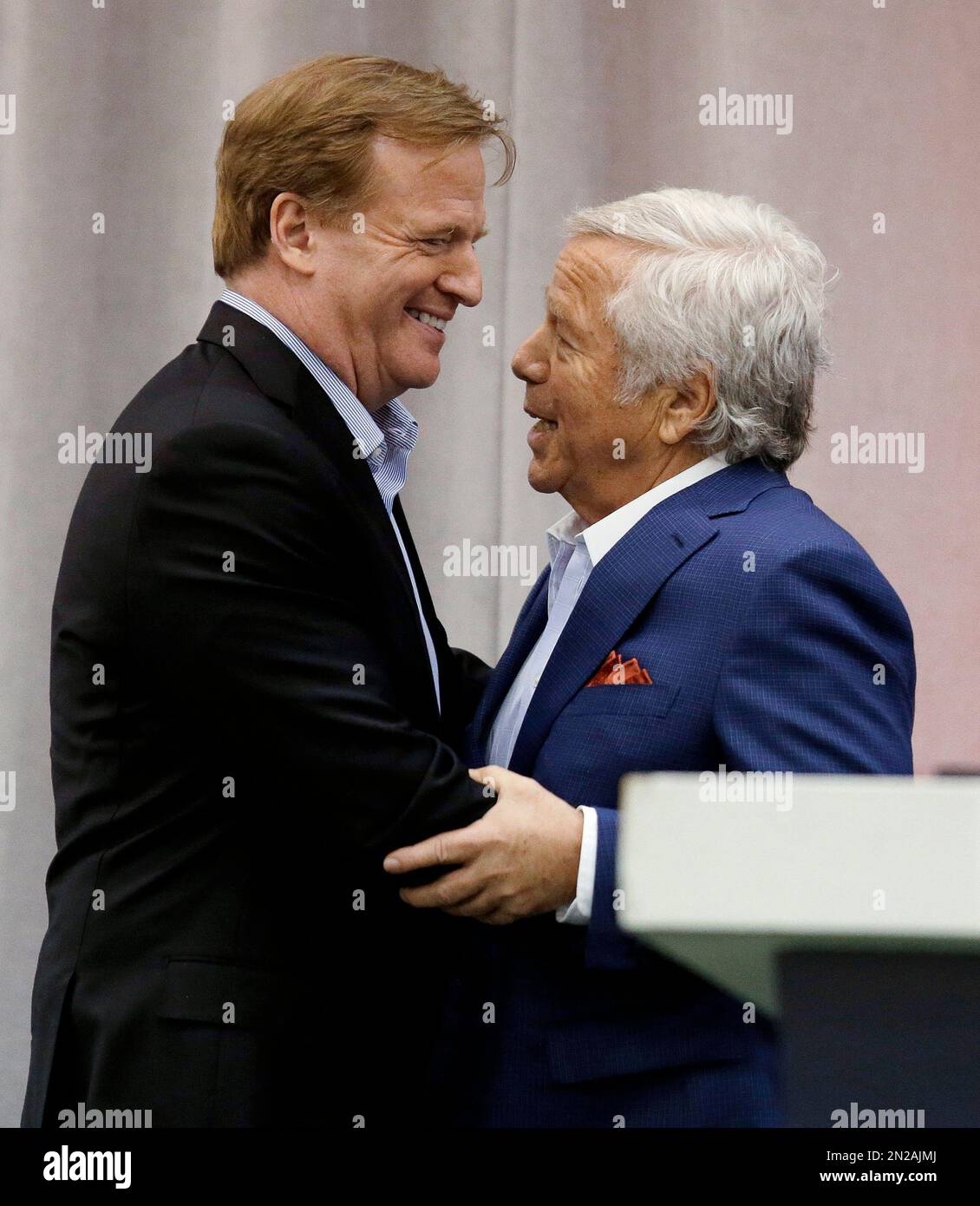 New England Patriots owner Robert Kraft (L), Denver Broncos owner Pat Bowlen  (C), and NFL commissioner Roger Goodell talk during team warm ups at Sports  Authority Field at Mile High on December