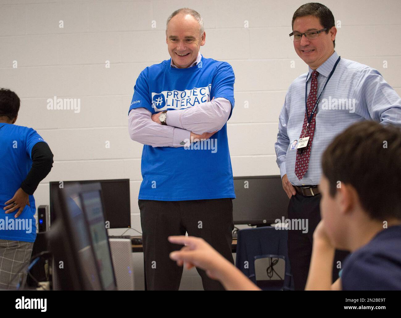 Pearson CEO John Fallon, left, speaks with Tejeda Middle School