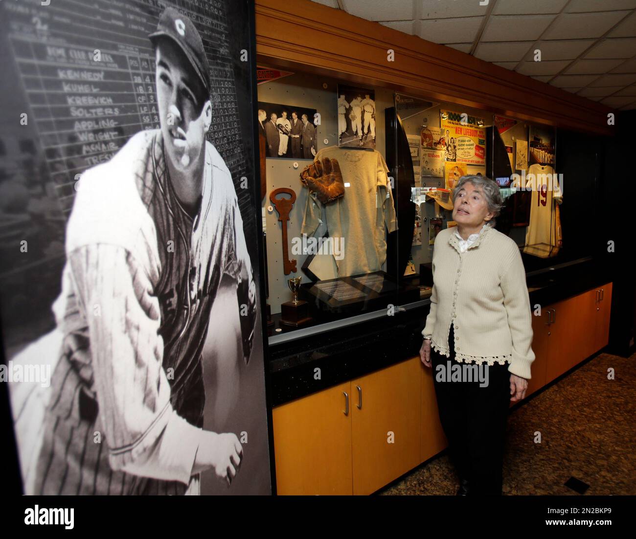 Anne Feller, widow of Bob Feller, walks through the Bob Feller exhibit  Wednesday, May 13, 2015, in Cleveland. The exhibit features many items from  Feller's playing and Navy careers from the former