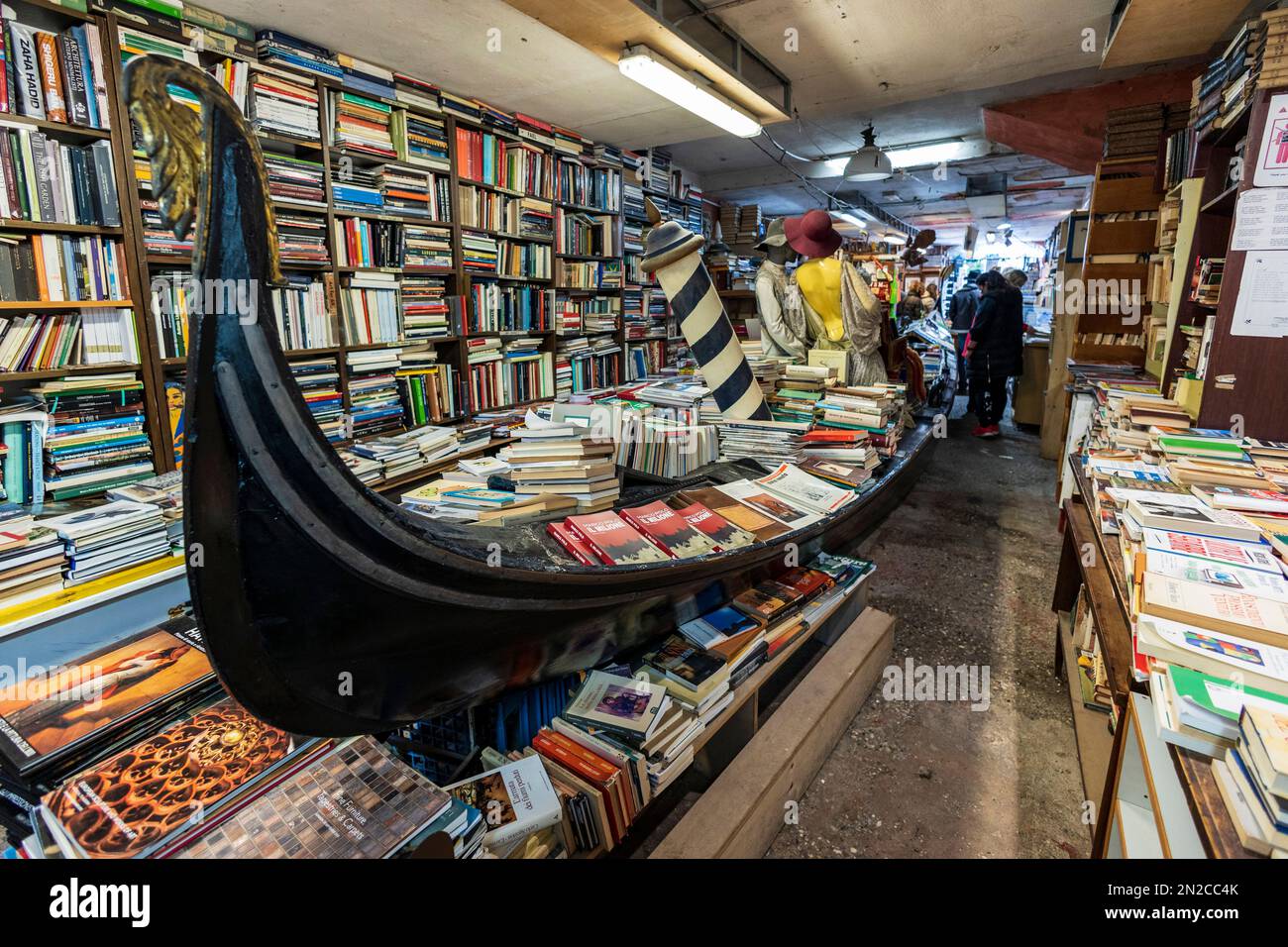 Book shop with gondola, Libreria Acqua Alta, Venice, Veneto, Italy, Europe Stock Photo