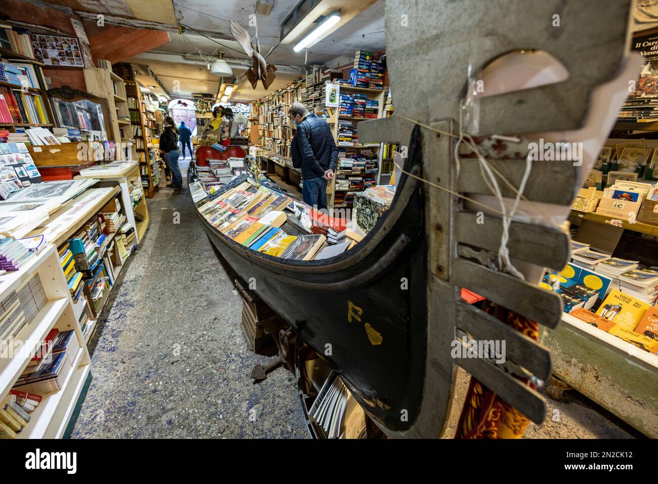Book shop with gondola, Libreria Acqua Alta, Venice, Veneto, Italy, Europe Stock Photo