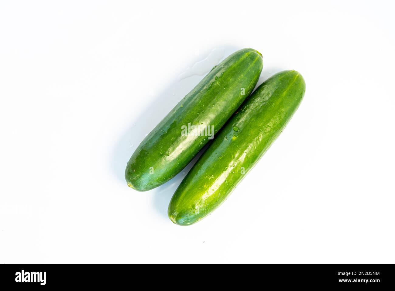 Two fresh cucumbers isolated on white background Stock Photo
