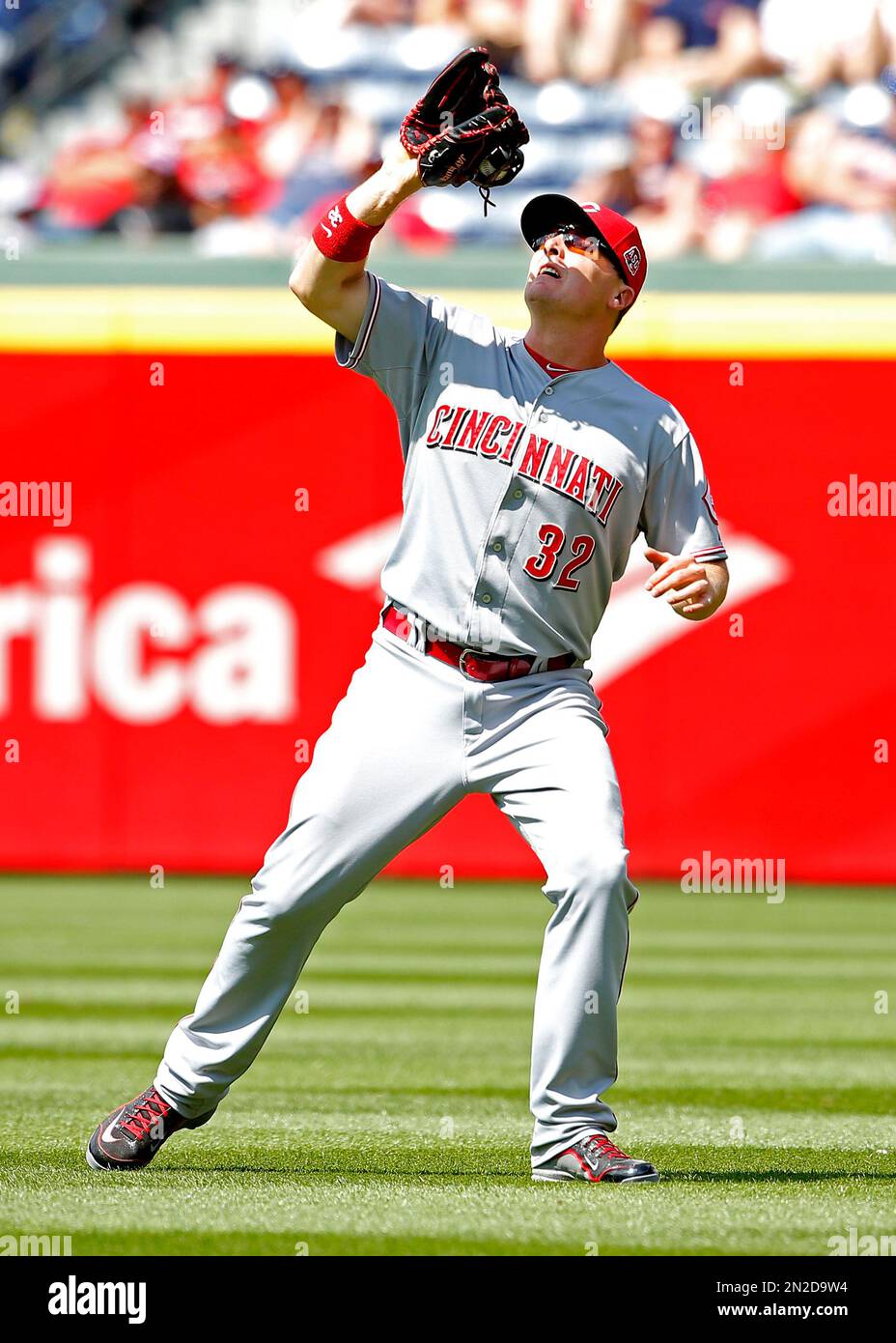 Cincinnati Reds right fielder Jay Bruce (32) catches a fly ball hit by  Atlanta Braves' Jonny Gomes in the eighth inning of a baseball game Sunday,  May 3, 2015, in Atlanta. The
