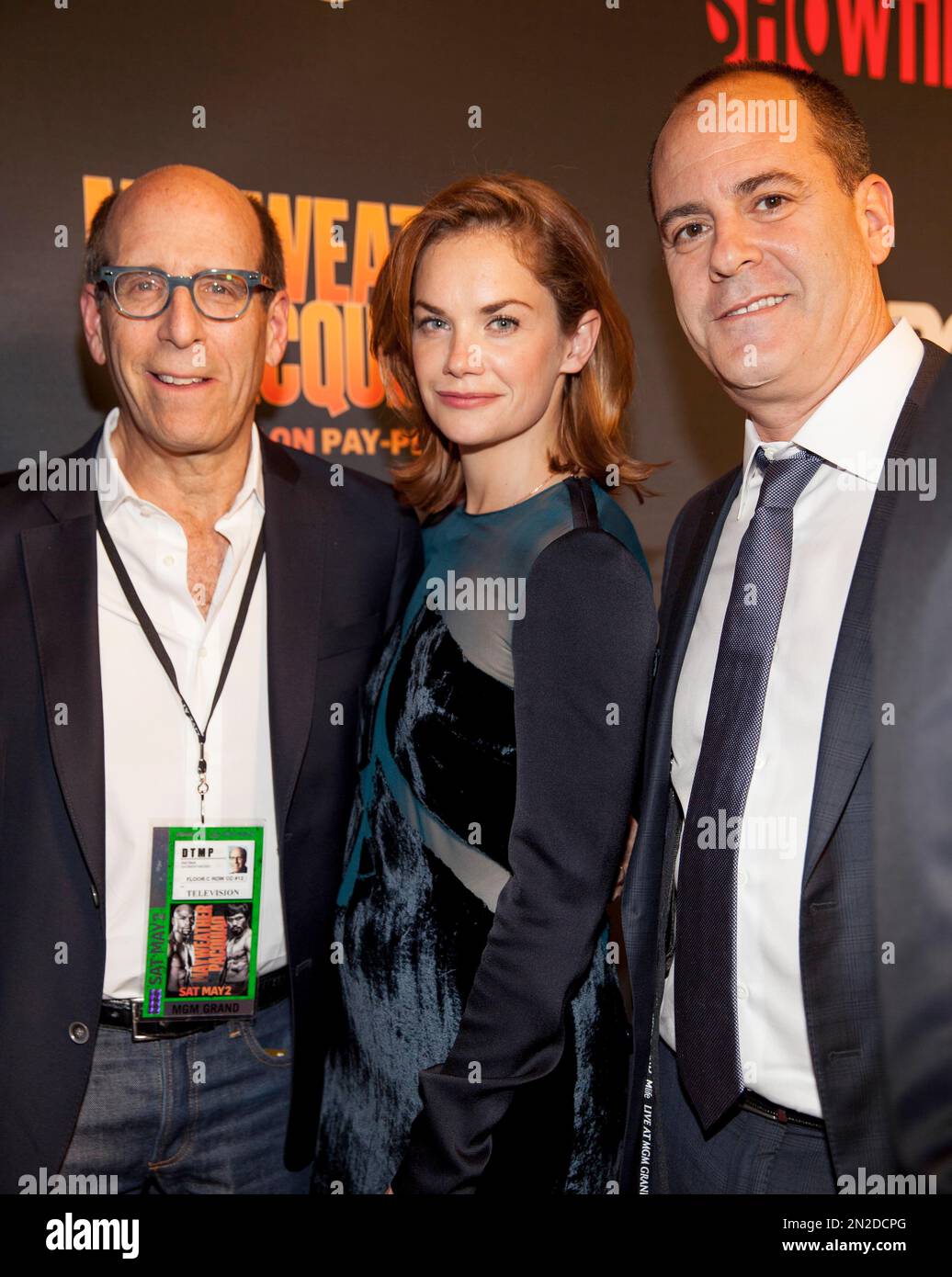 Matt Blank, Ruth Wilson, and David Nevins pose on the red carpet at the